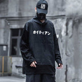 man wearing a black japanese hoodie and a black techwear cap