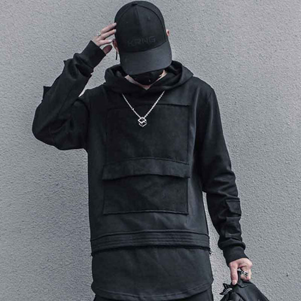 Man wearing Hoodie with front pocket, a techwear cap and a techwear necklace