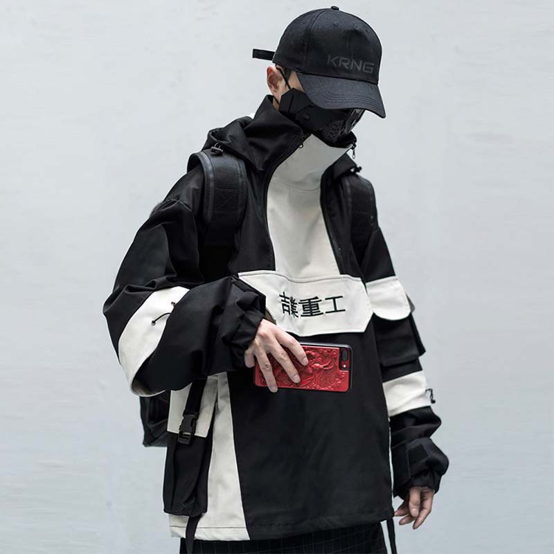 Man wearing a japanese hoodie techwear and a black cap
