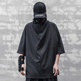 Man weargin a punk japanese hoodie and a black techwear cap