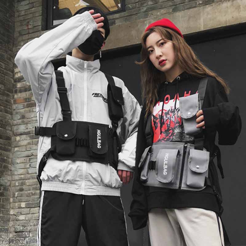 man and women wearing chest rig mag pouches