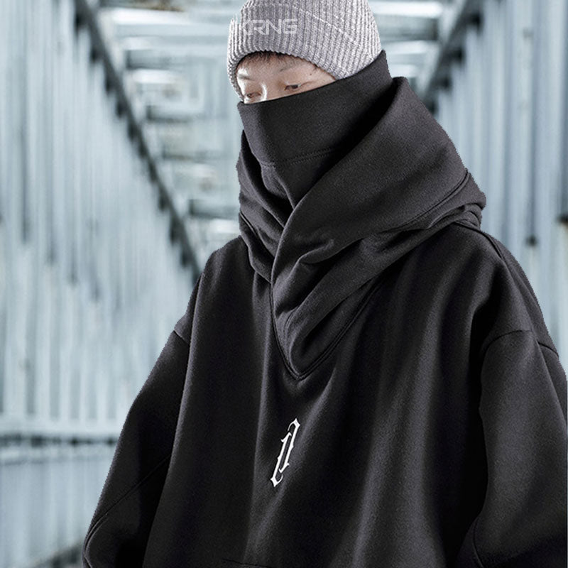 a man wear a tecchwear mask and a black cyberpunk hoodie style