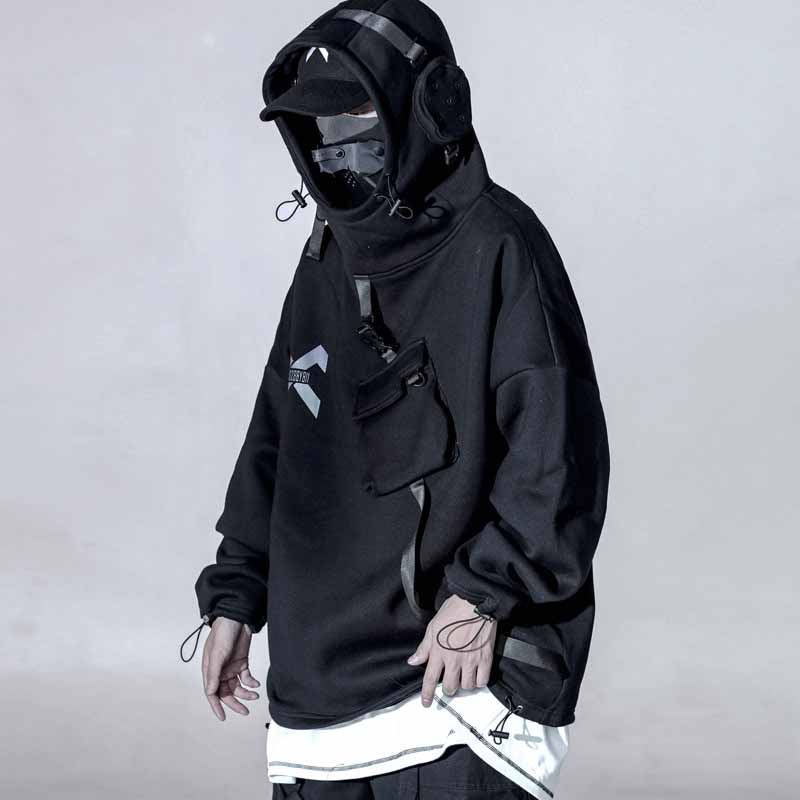 Man wearing a hoodie with built in headphones, and a techwear mask