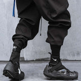 Ninja techwear pant with black streetwear sneakers