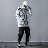 Black cargo pants and techwear jacket white worn by a man