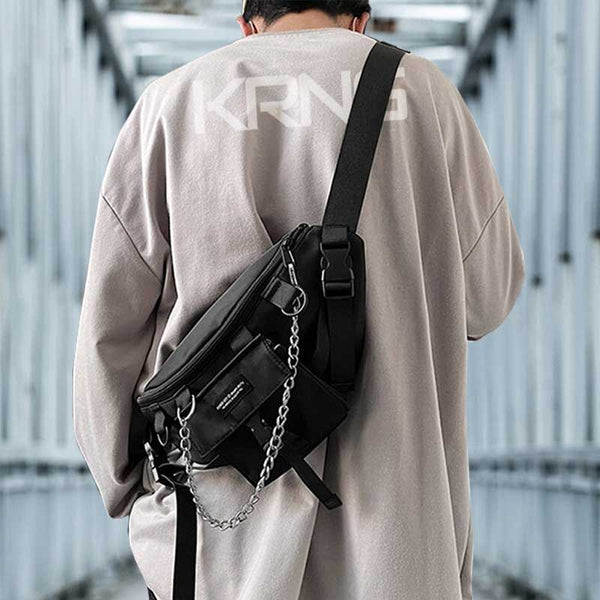 Man wearing a techwear sling bag with a oversize t shirt 