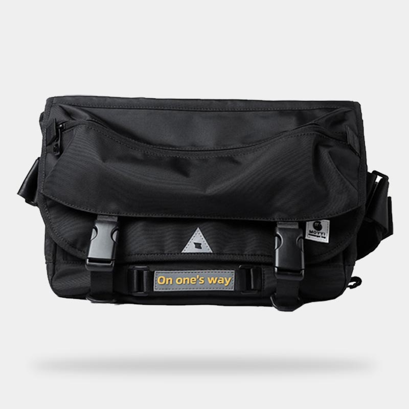 Black techwear travel bag worn on shoulder for dark outfits